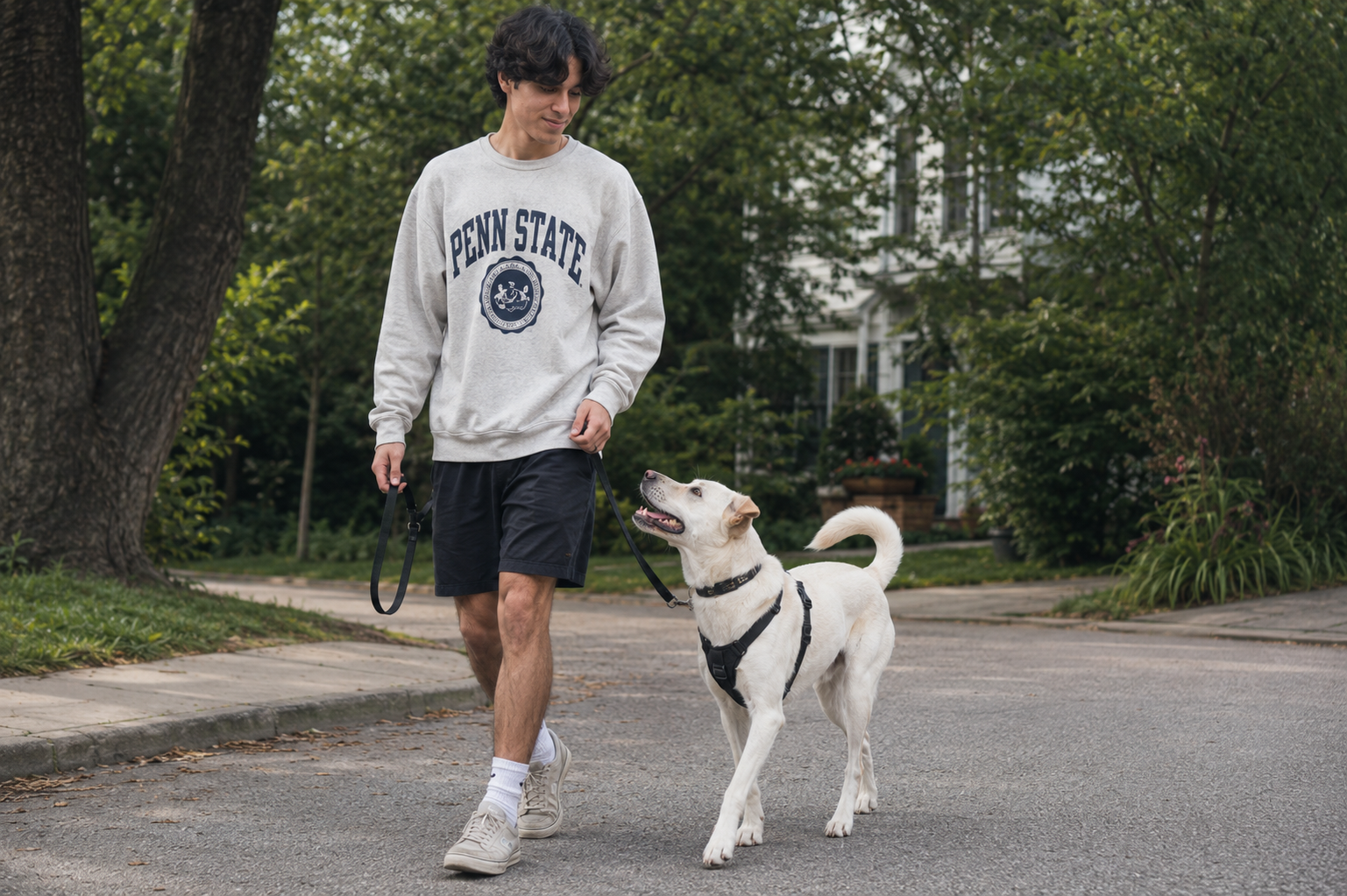 Vincent Prado practicing loose-leash walking with a dog